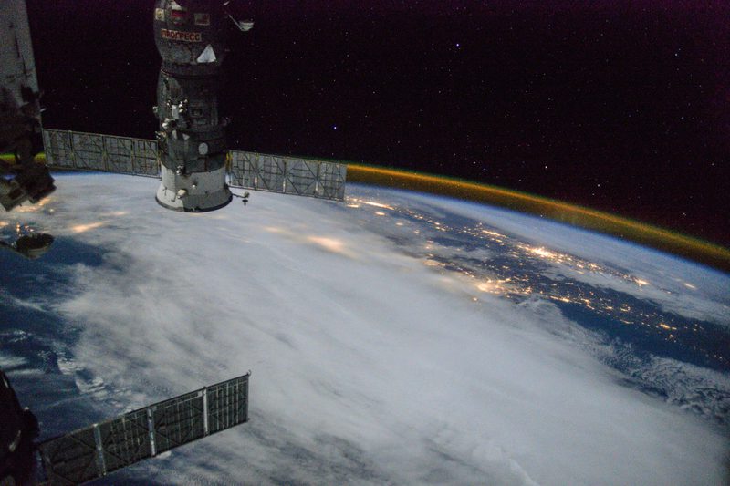 View of Earth and Soyuz module at night from the ISS